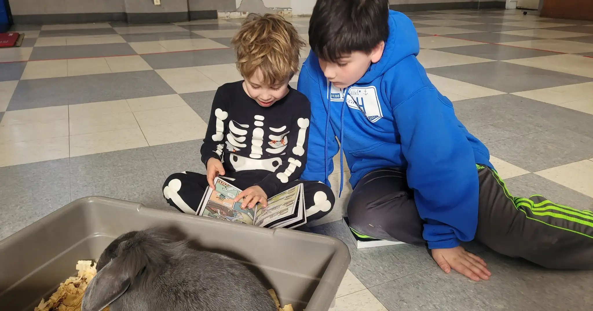 Older and younger students reading together at JCDSRI